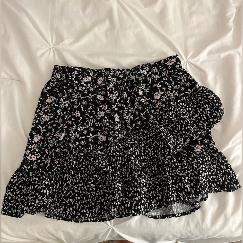 black mini skirt with flower details